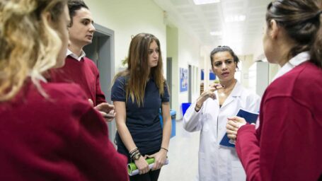 Turkish students and their teacher at Istanbul secondary school, university, Talking during break, hallway, Istanbul, Turkey. Nikon D800, full frame, XXXL.