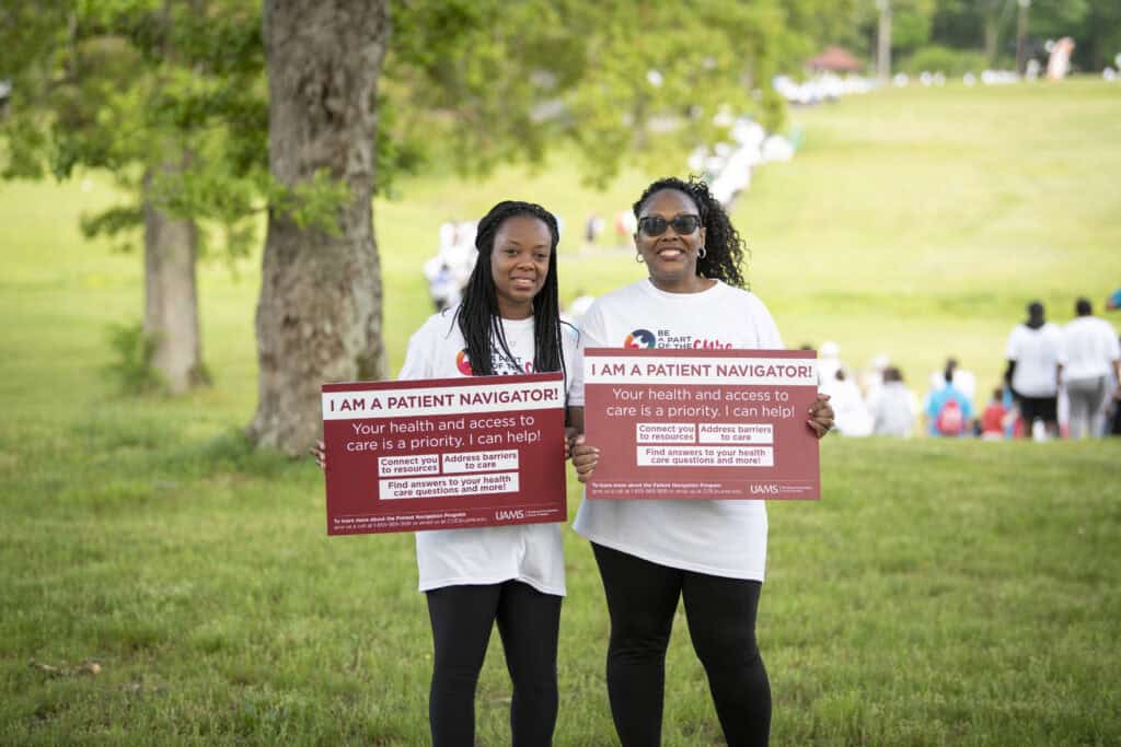 Cancer Patient Navigators (l to r) Robin Thrower of Magnolia, and
Carline Massey of Texarkana, promote the new statewide patient
navigation program at the Be a Part of the Cure Walk.