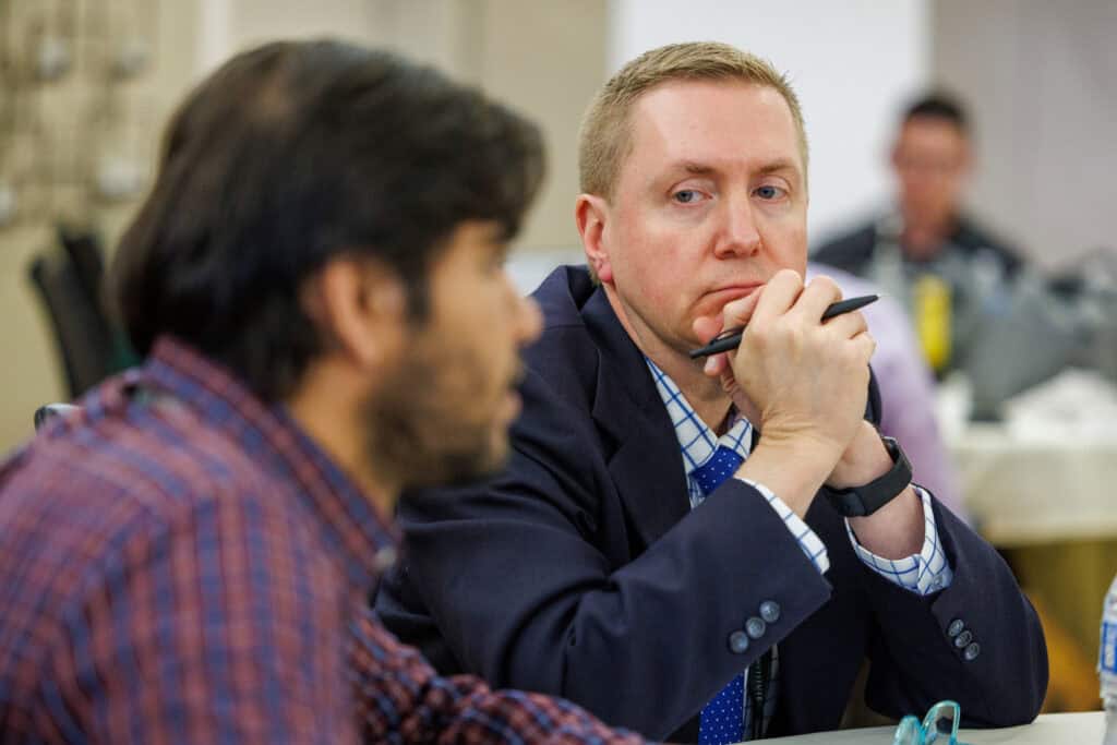 Dr Scott Dickson, UAMS Northeast FM Residency PD, engaging in small group conversation with students.