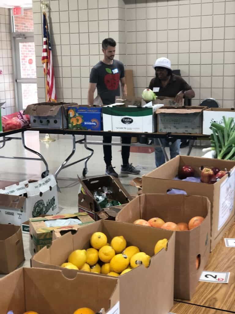 Good Food RX event with boxes of food and participants