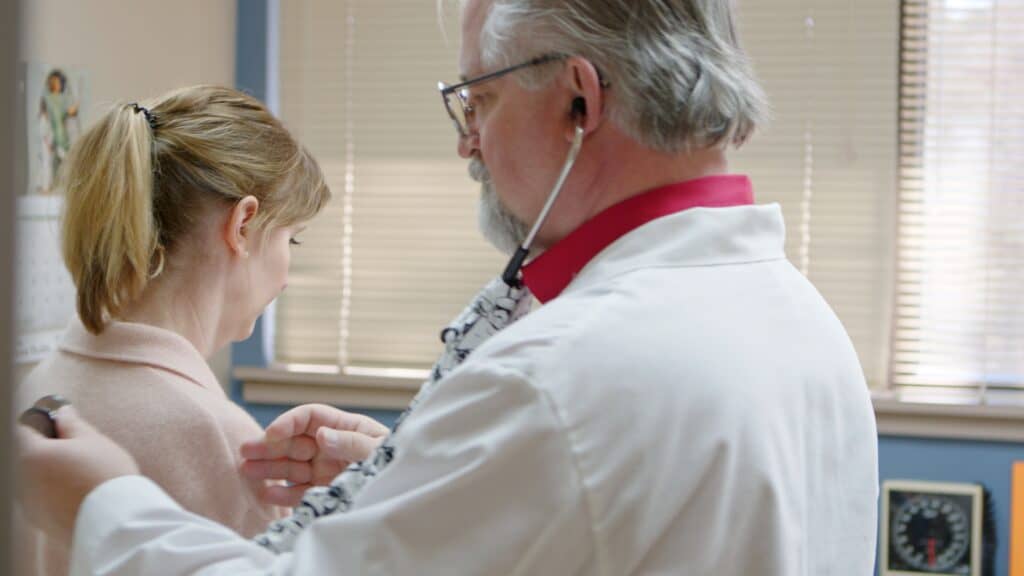 Jon Loudermilk, MD, Site Director for the Washington Regional Eureka Springs Family Clinic, conducting a patient exam. 