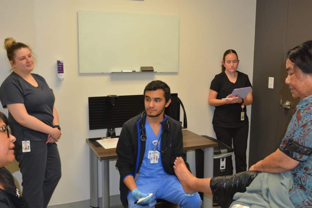 UAMS Northwest interprofessional students serving patients at the Marshallese Clinic