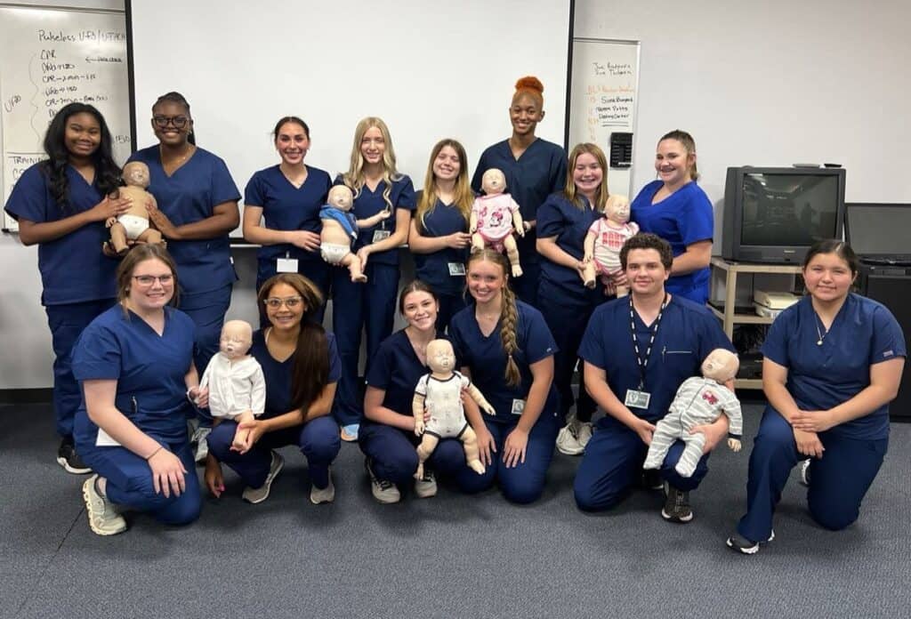 UAMS Southwest MASH students participating in infant CPR training