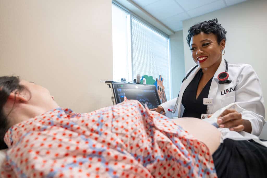 C’Asia James, M.D. examines a pregnant patient at the UAMS South Regional Campus in El Dorado Arkansas