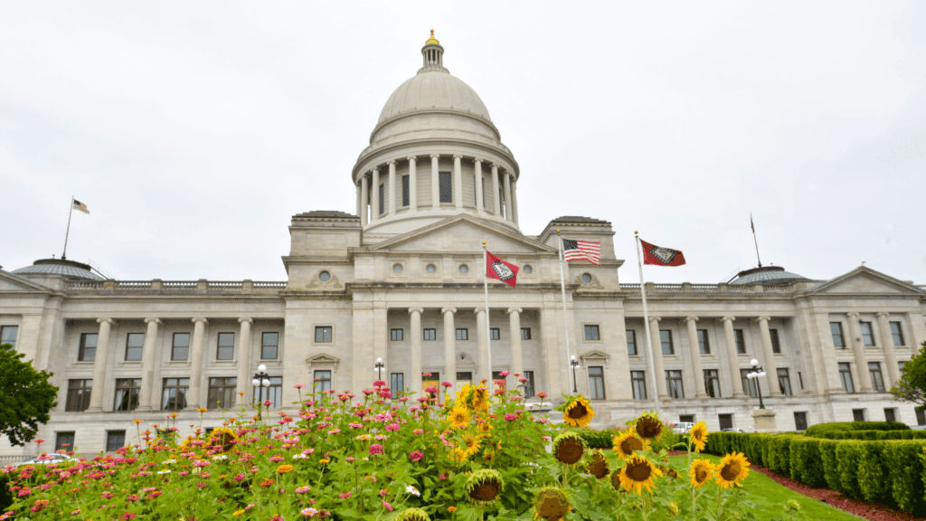 Arkansas State Capitol building with flowers in the foreground