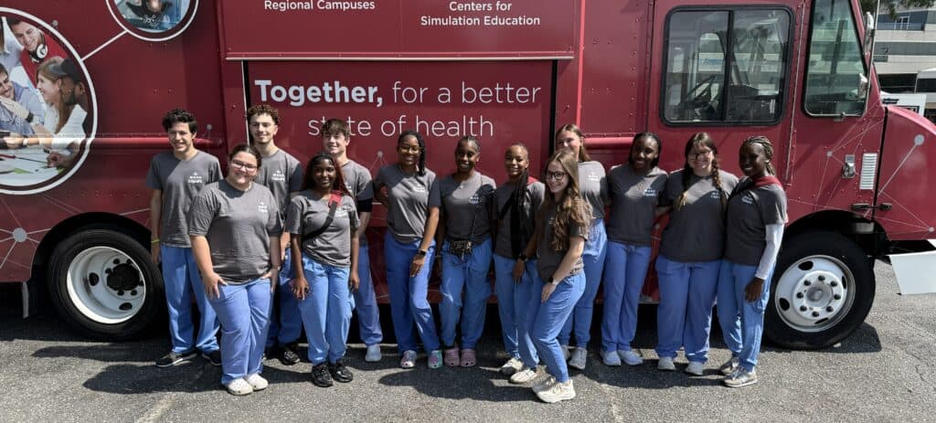 Pine Bluff MASH students in front of Mobile Education Unit