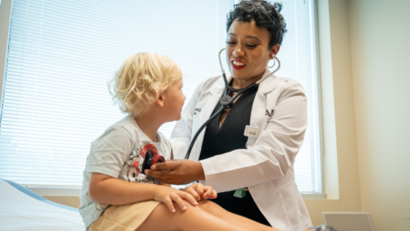 Dr. C'Asia James with a patient in El Dorado